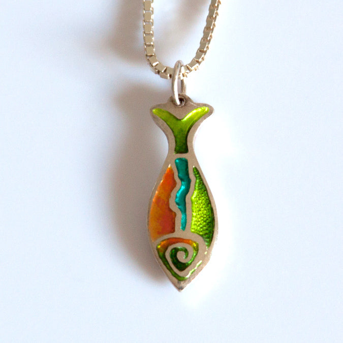 Champleve enamel folk art fish pendant with red orange belly, green back and blue lake shown along its side. Hung on chain.