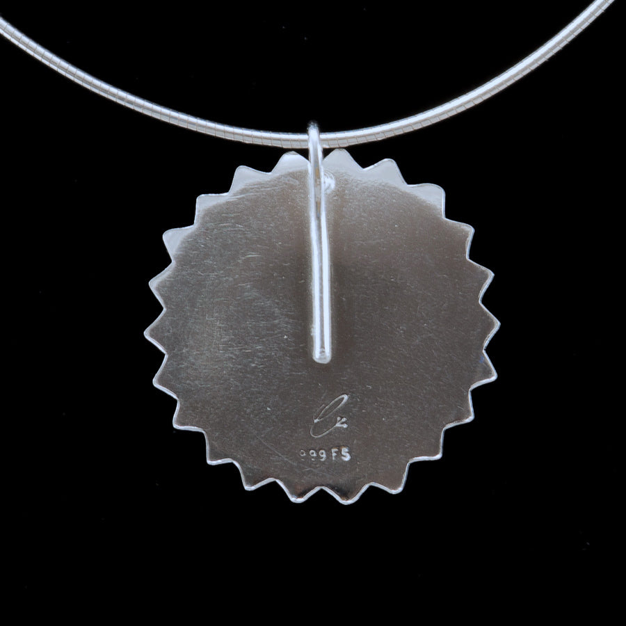 back view of pendant necklace with maker's mark and quality stamp