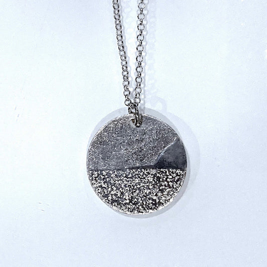 Sand dune bluff and lake image on round sterling silver pendant