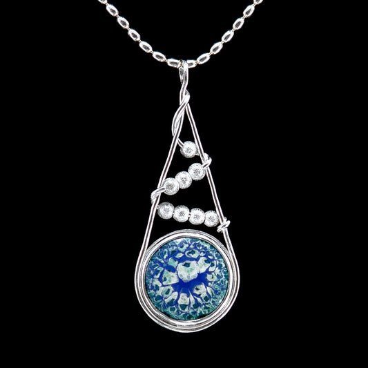Snowfall Ice enamel pendant necklace in shades of blue, white and aqua. Silver beads trail down like falling snow