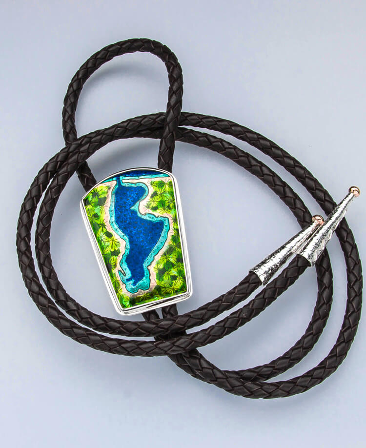 portage lake enamel bolo tie with black braided leather cord, set in silver