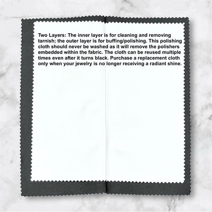 Polishing cloth with text on a marble background