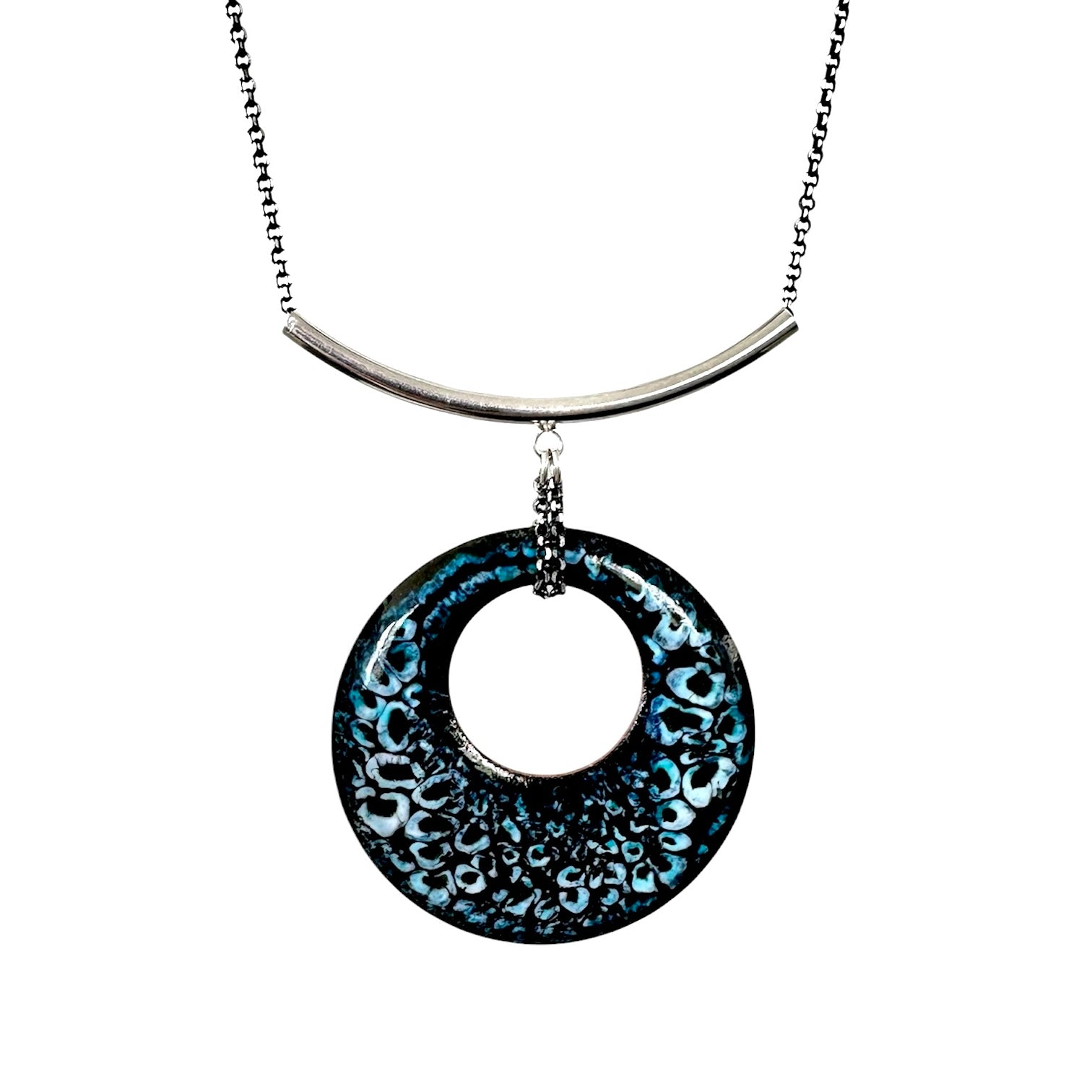 Turquoise, black and white enamel pendant on silver curved bail with white background