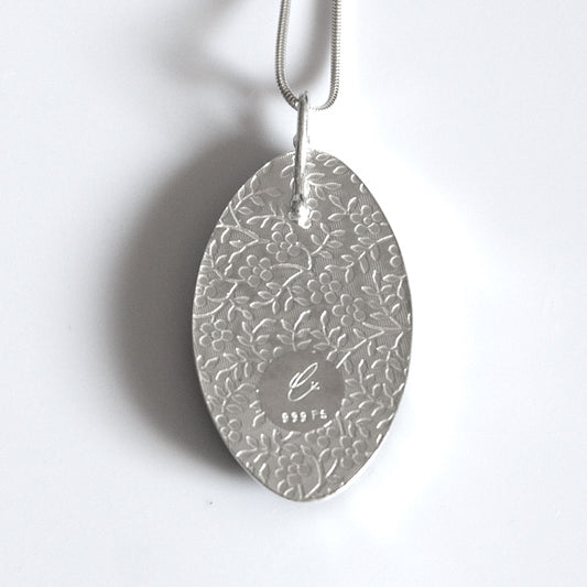 Back view of Calla Lily pendant necklace. Fine silver setting with a roller milled flower pattern.