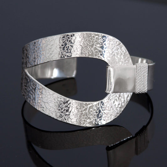 Sterling silver cuff bracelet with embossed flower pattern